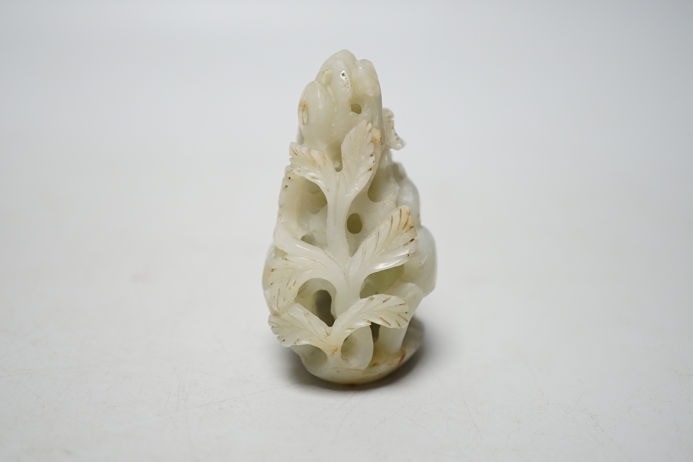 A Chinese pale celadon jade ‘deer’ carving, 7cm
